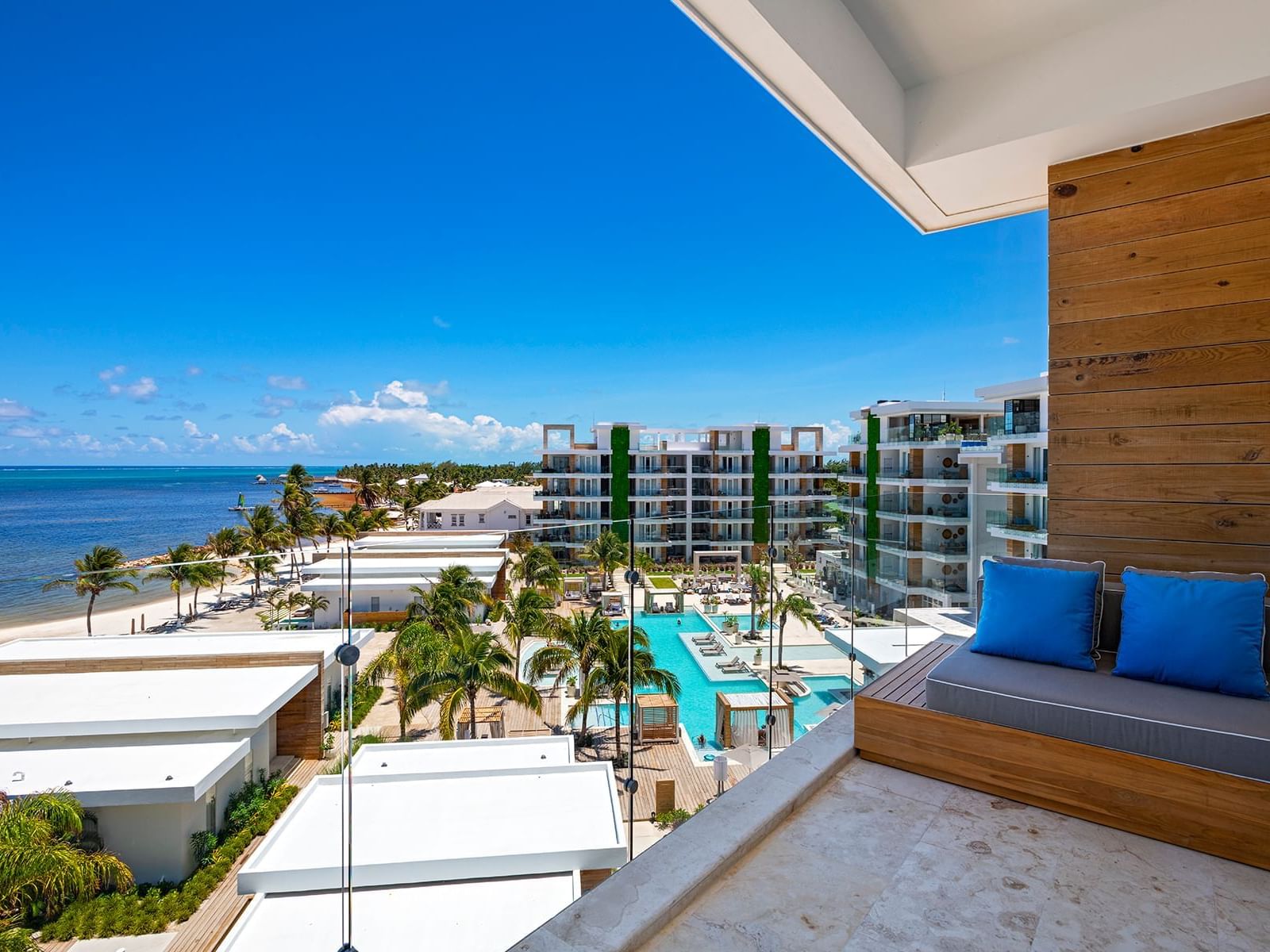 Outdoor balcony area in Oceanview Vista One Bedroom Suite at Alaia Belize Autograph Collection