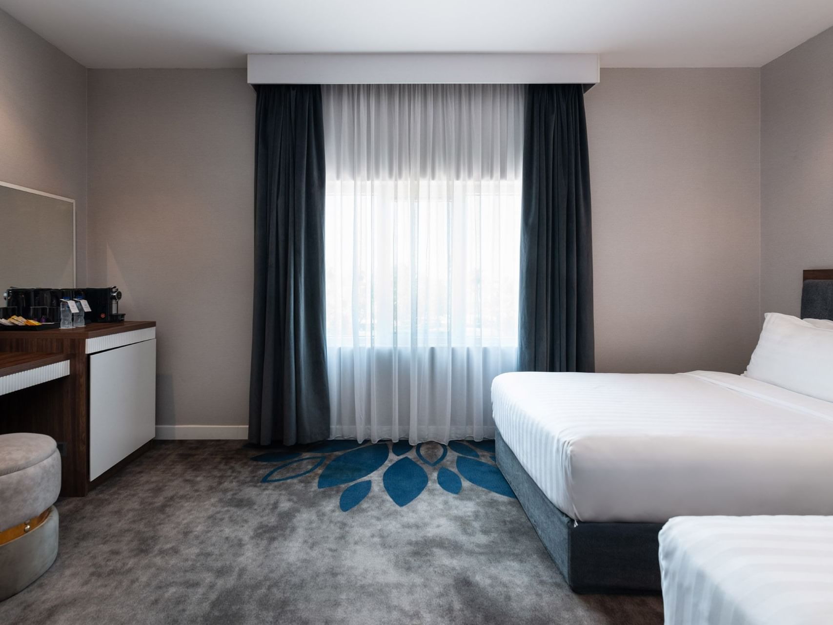 Two beds and workspace in Royal Suite Sea View at Warwick Hotels & Resorts