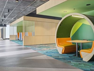 Modern lounge area with vibrant seating and colorful walls at Mayoral Drive Student Accommodation.