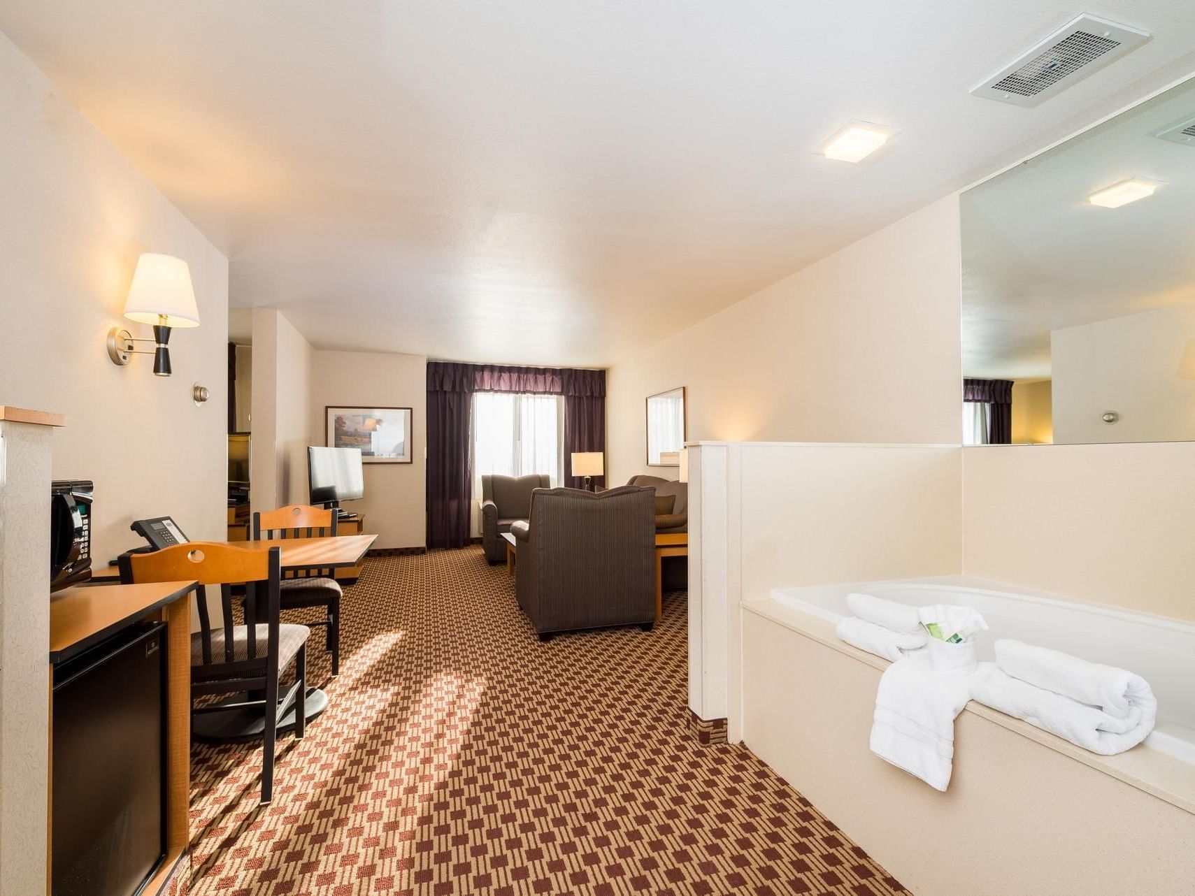 Living area in King Executive Jetted Tub Suite at Crystal Inn Hotel & Suites