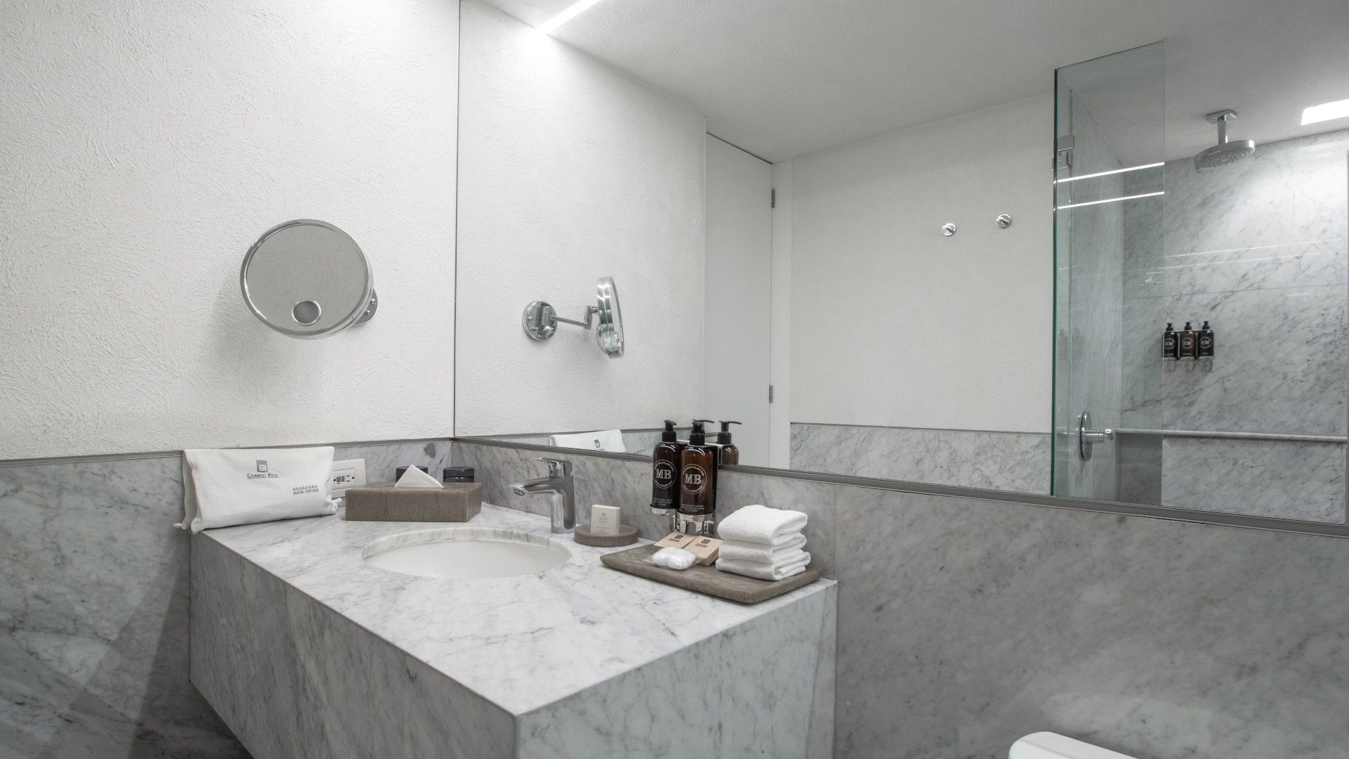 Clean marble vanity and modern fixtures in 2 Double Superior Deluxe bathroom at Camino Real Polanco Mexico