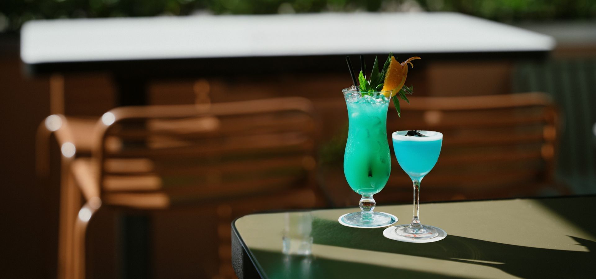 Two vibrant blue cocktails served in Pumphouse Sydney at Novotel Darling Square