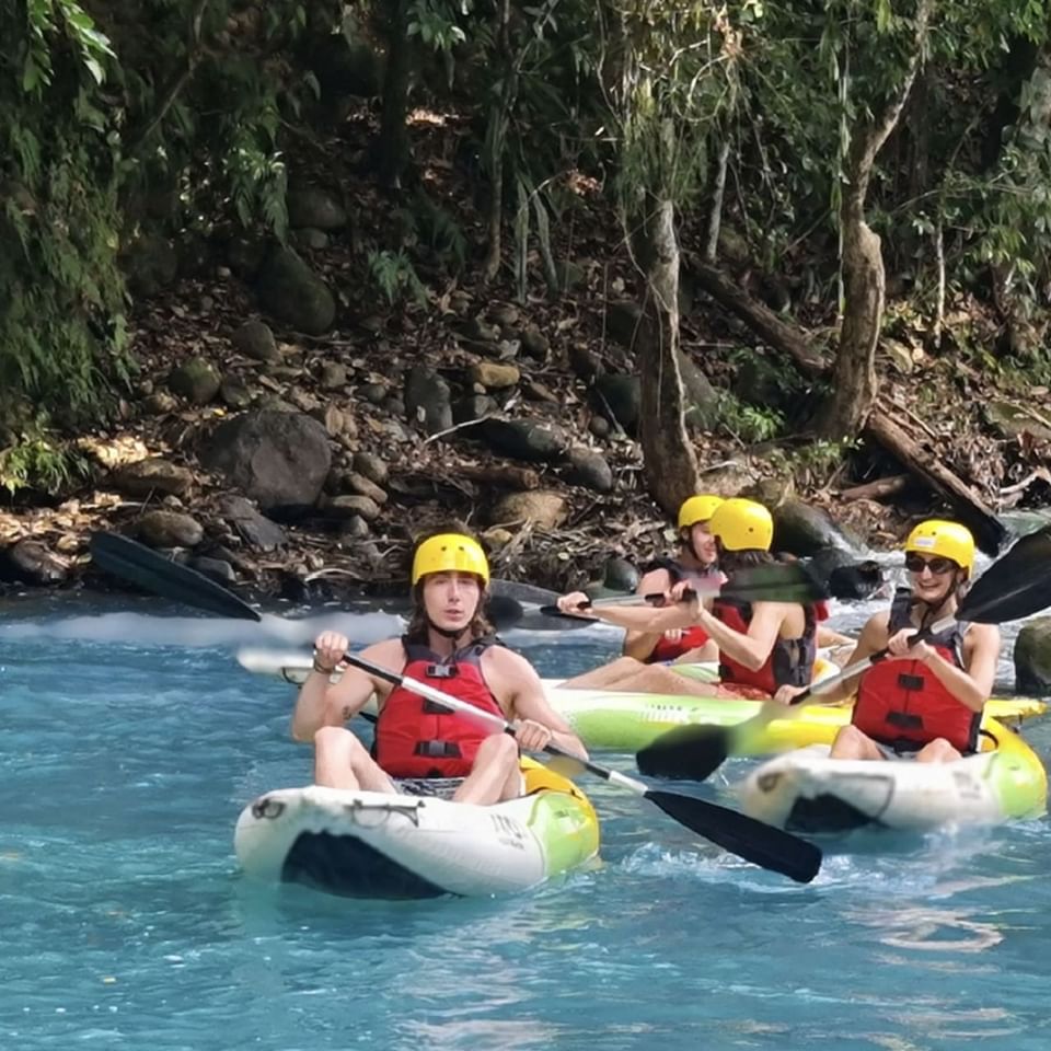 People kayaking on the river near Hideaway Rio Celeste