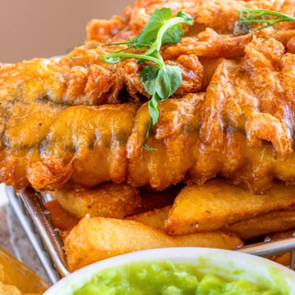 Fish and chips meal with mushy peas and tartare