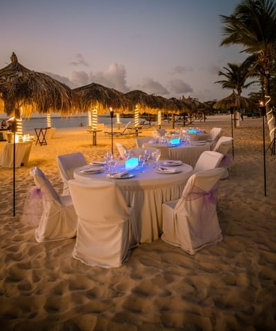 The elegant dinner table on the beach at Amsterdam Manor Resort
