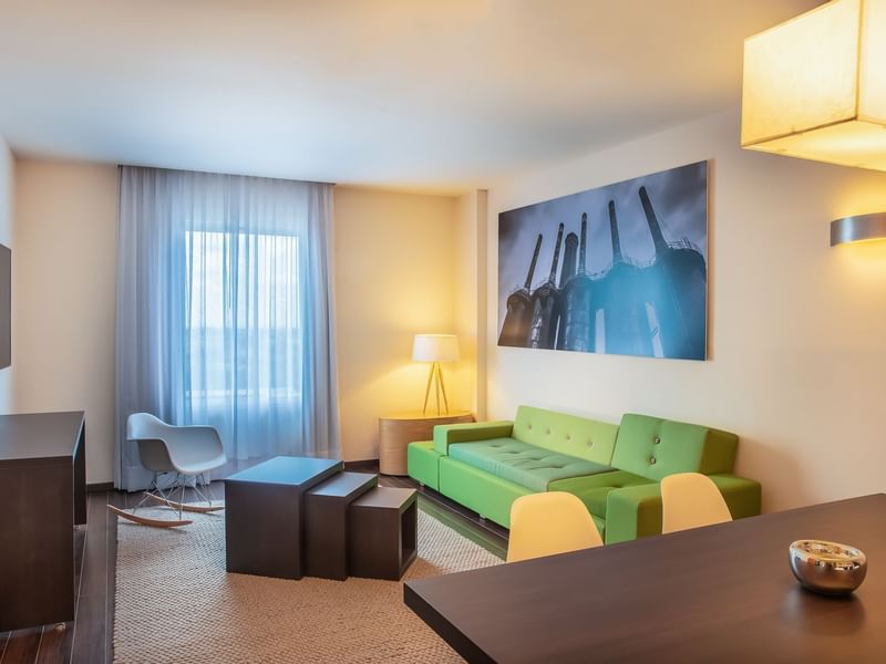 Green couch and elegant lamps at Fiesta Inn
