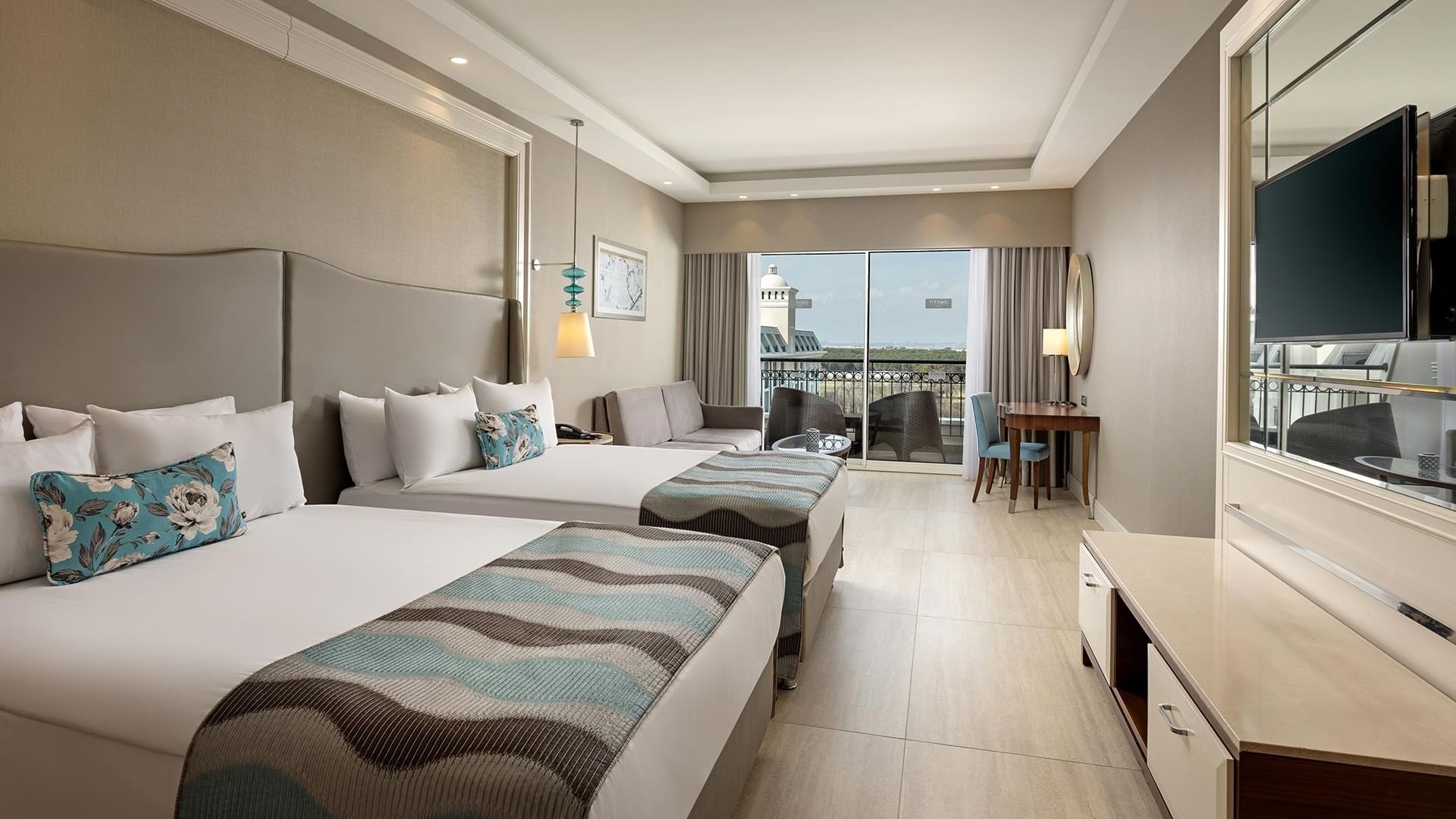 Superior Room with two beds, balcony, and modern decor at Titanic Deluxe Golf Belek in Antalya.