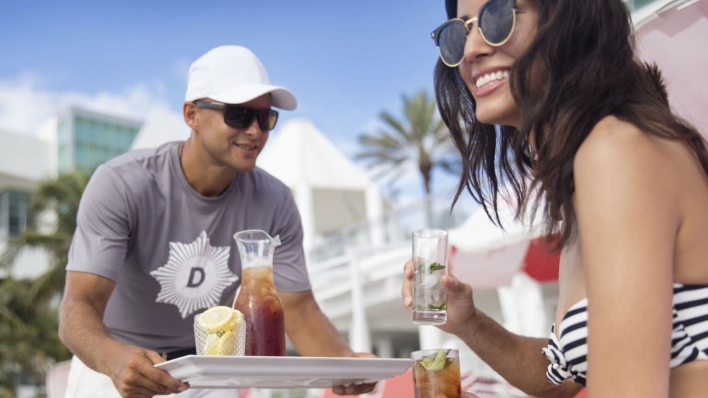 Man serving cocktails in Playa Restaurant & Bar at The Diplomat Resort