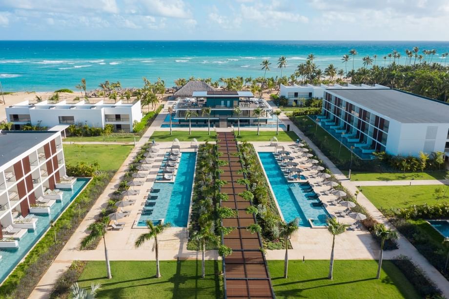 Exterior view of the hotel featuring pool, sea & amenities at Live Aqua Punta Cana