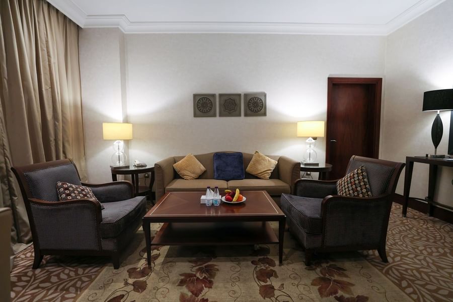 Executive suite living room featuring sofa with armchairs and a central coffee table at Saja by Warwick Makkah