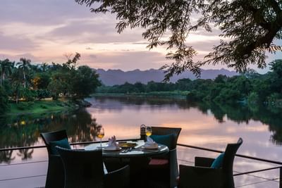 Four seat dining table with view of lake at U Hotels & Resorts