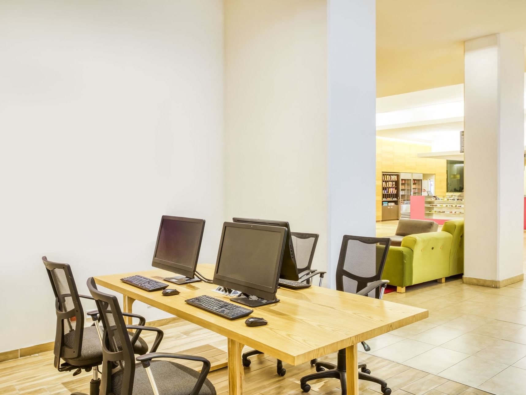 Computers & furniture in a Business center at Fiesta Inn Hotels