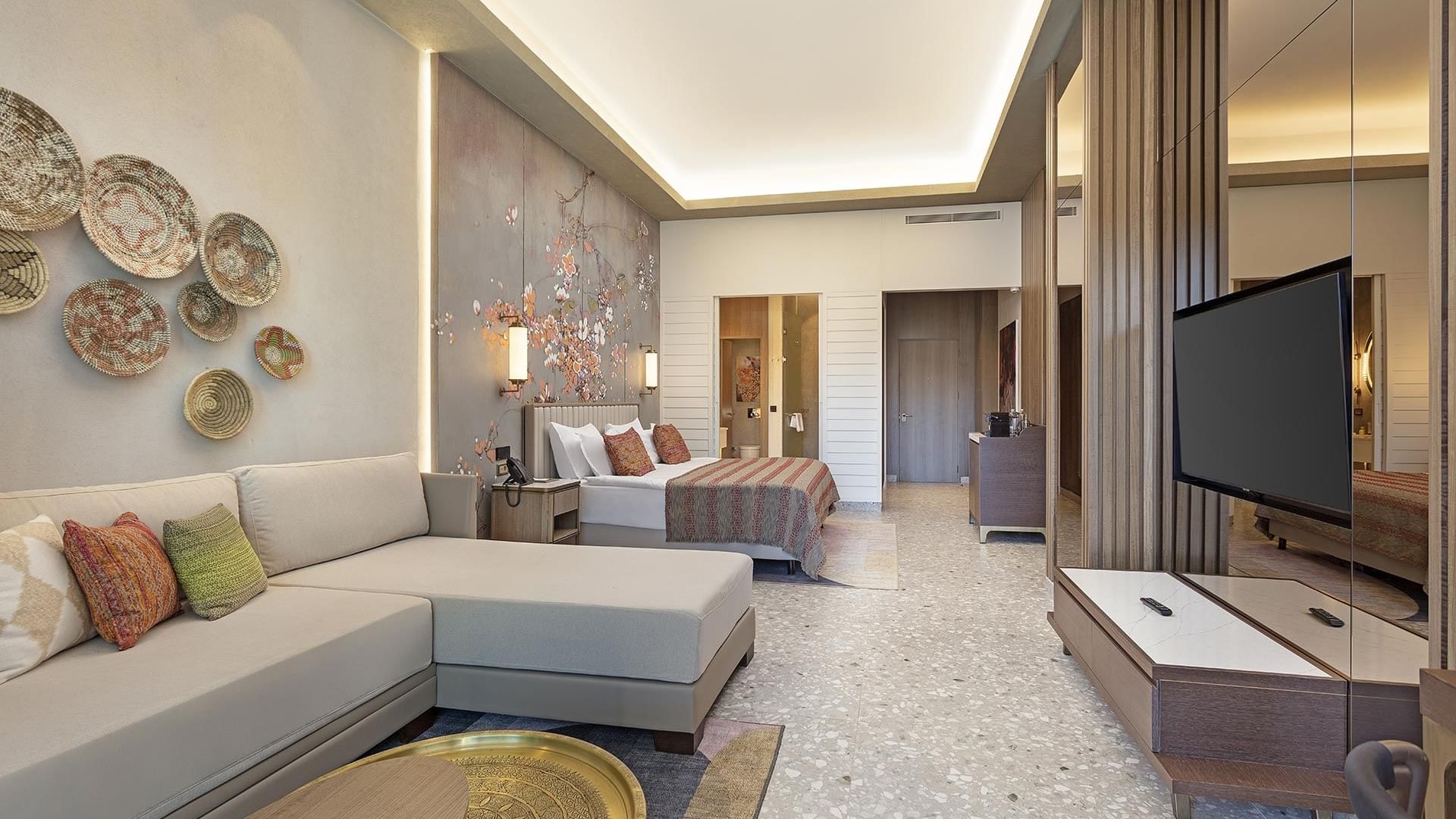 Spacious bedroom, TV area with a comfy sofa in Superior Swim-up Room at Cullinan Belek