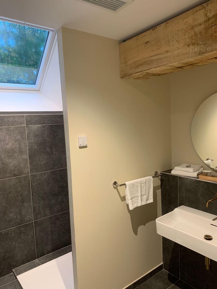 Vanity & towel bar in a bathroom of a room at Originals Hotels