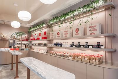 Snacks, gourmet pastries, & coffee on shelves in Beaucoup Bakery & Cafe at The St. Regis Hotel Vancouver