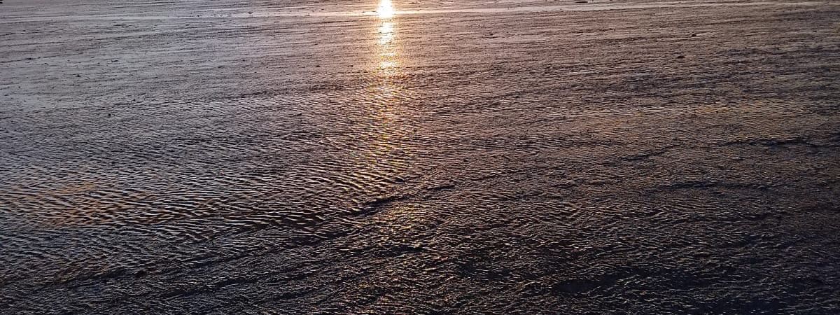 Sunset over the ocean with reef walking at Tambua Sands Beach Resort in Sigatoka