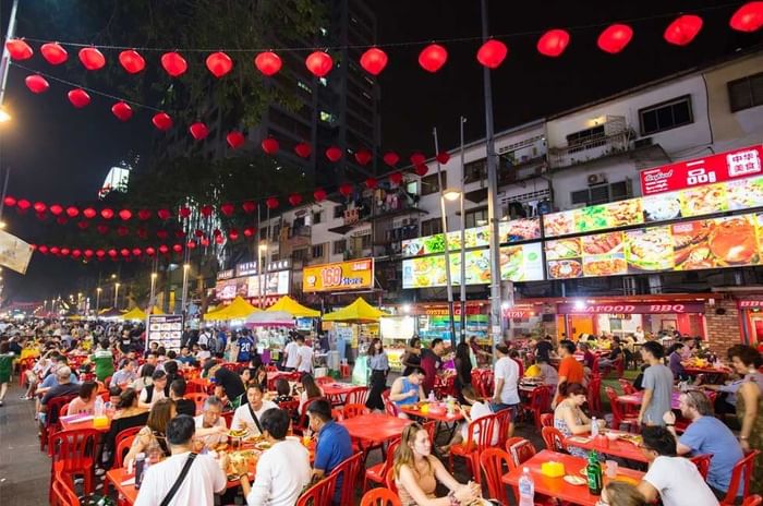 Crowded urban street filled with people near Imperial Lexis Kuala Lumpur