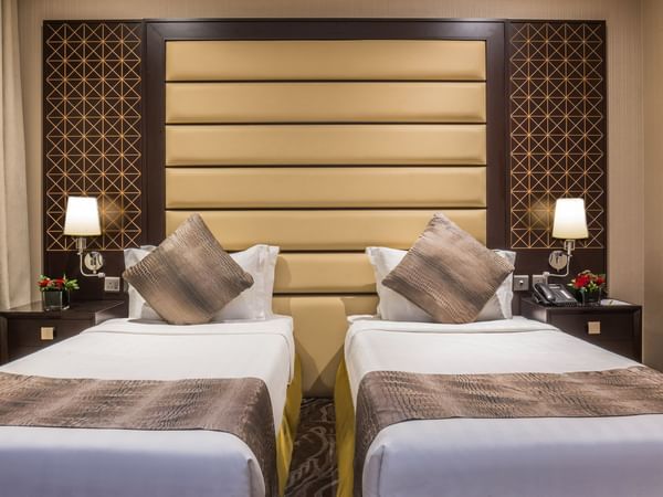 Twin Standard with two beds and mini lamps on the side tables at Warwick Al Khobar