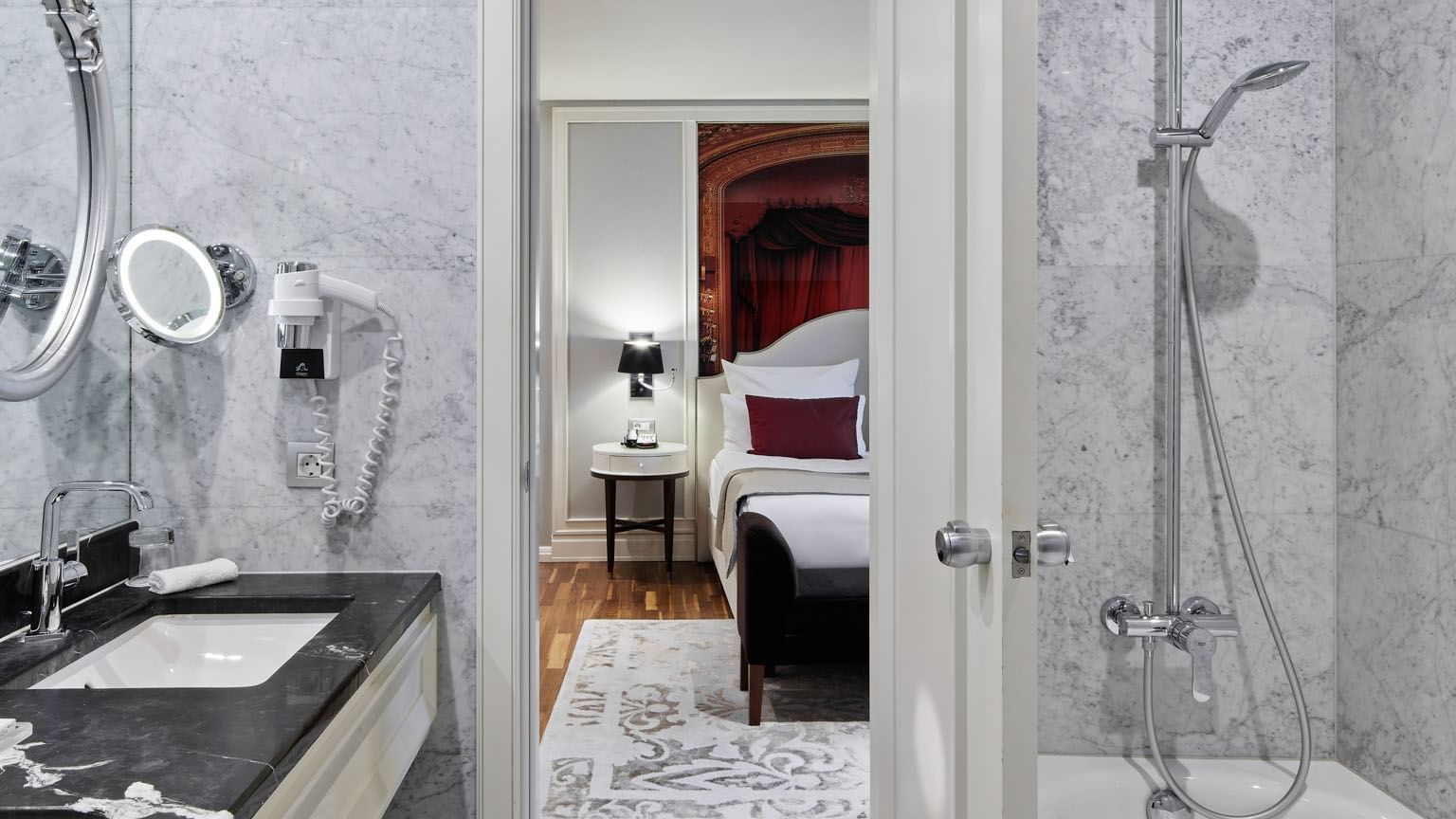 Bathroom with vanity & shower area in Sezen Aksu Suite at Titanic Gendarmenmarkt Berlin