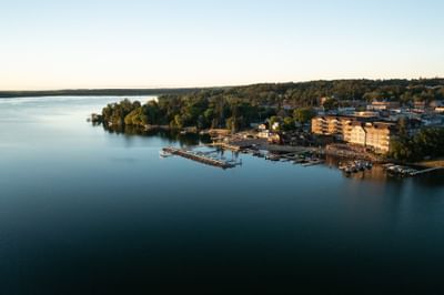 An Aerial view of chase on the lake hotel and lake at sunset