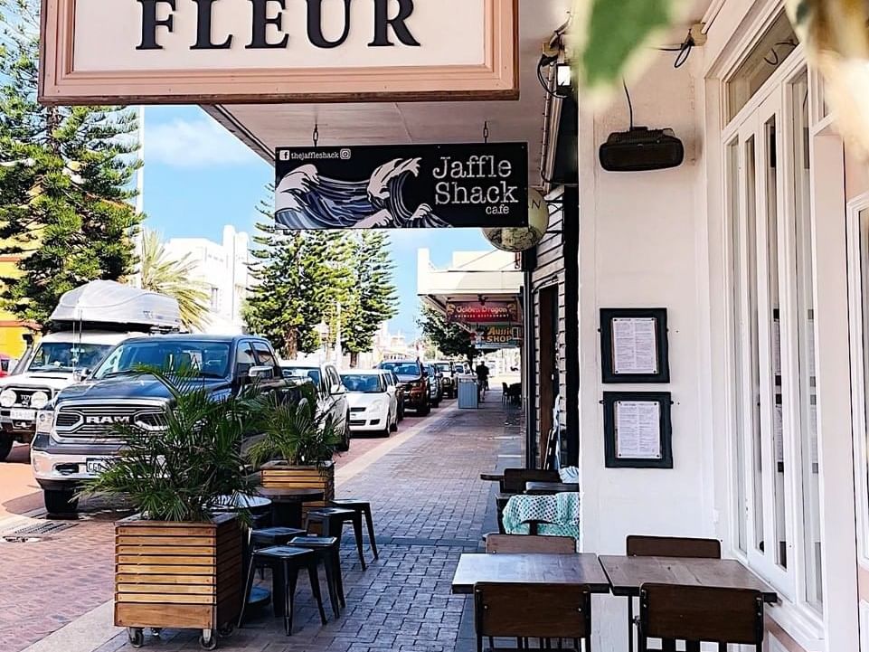 Outdoor dining area in Café Fleur near Ocean Centre Hotel