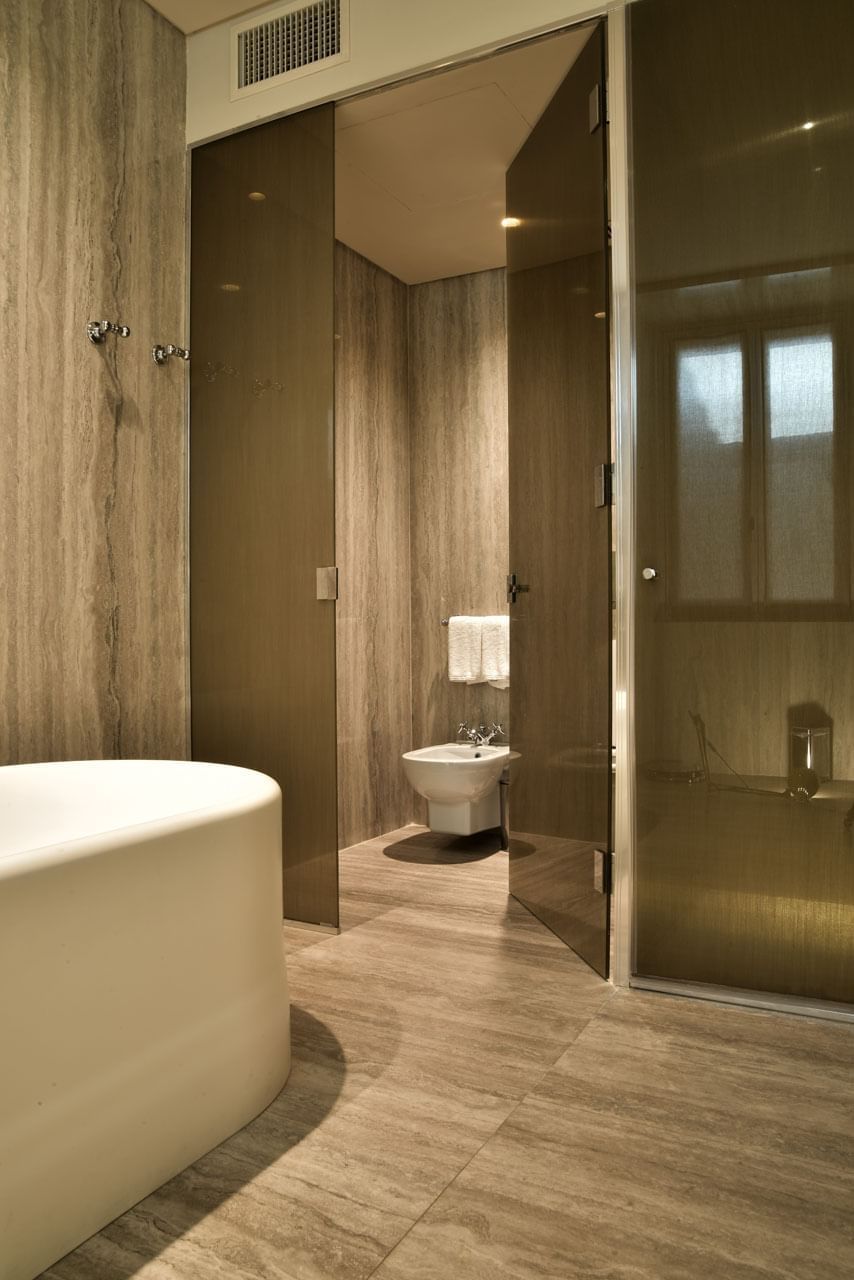 Bathroom interior with amenities & vanity in Garden Suite at Margutta 19