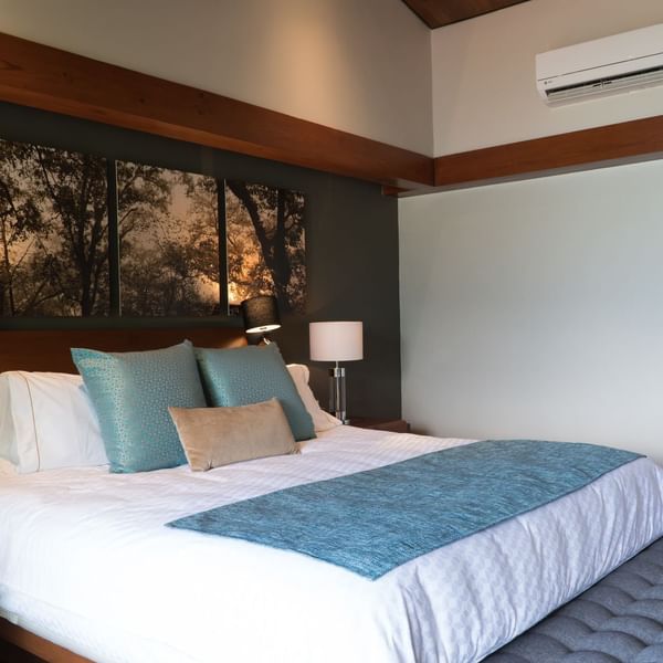 Large bed & cushions in the Superior Room at Gamma Hotels