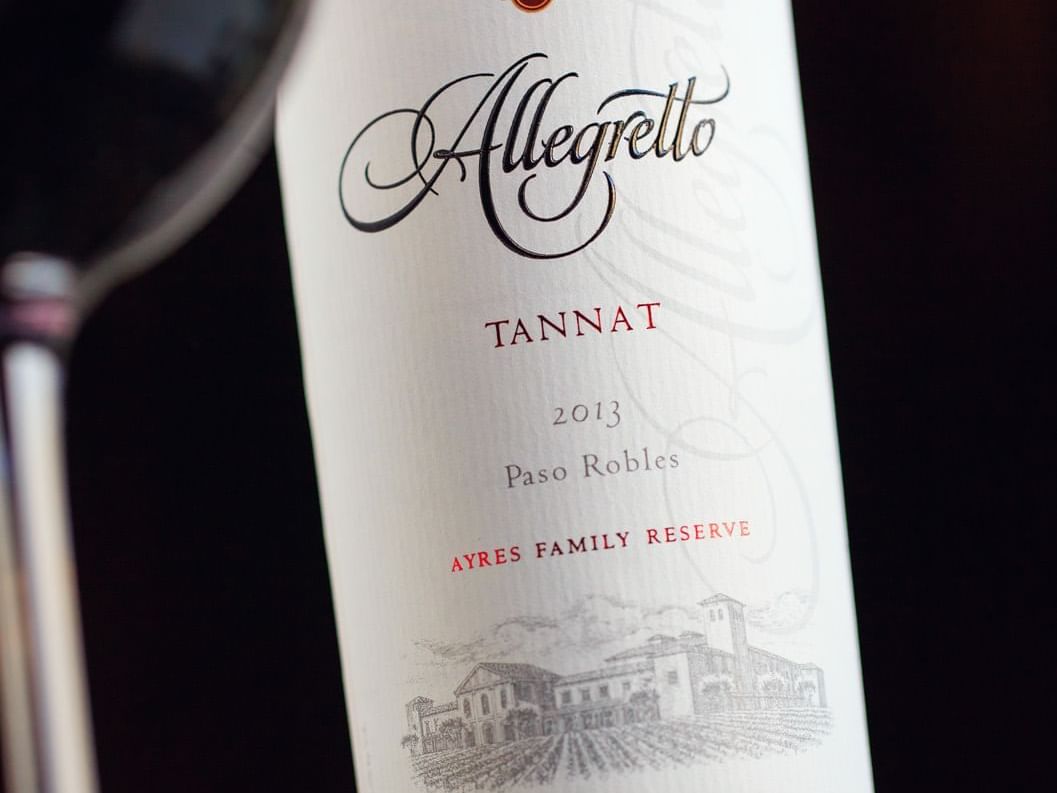 Allegretto bottle of house tannat wine and wine glass