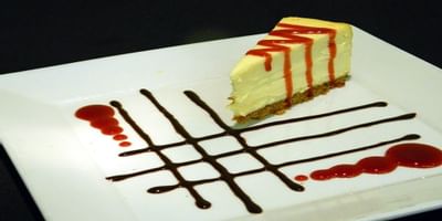 close up of nicely plated cheesecake at Bay Club Hotel