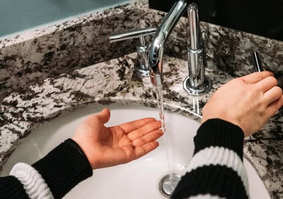 Washing hands in sink