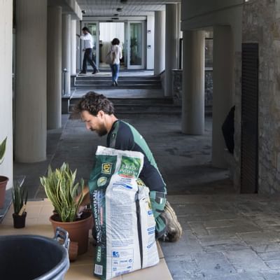 A man treating plants- Grand Hotel Portovenere