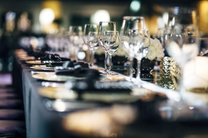 Close-up on arranged dining table set-up  in Fancy Dark Restaurant at The Diplomat Resort