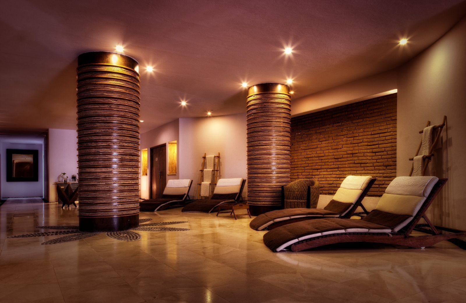 Lobby area with lounge chairs in the spa at Marquis Los Cabos