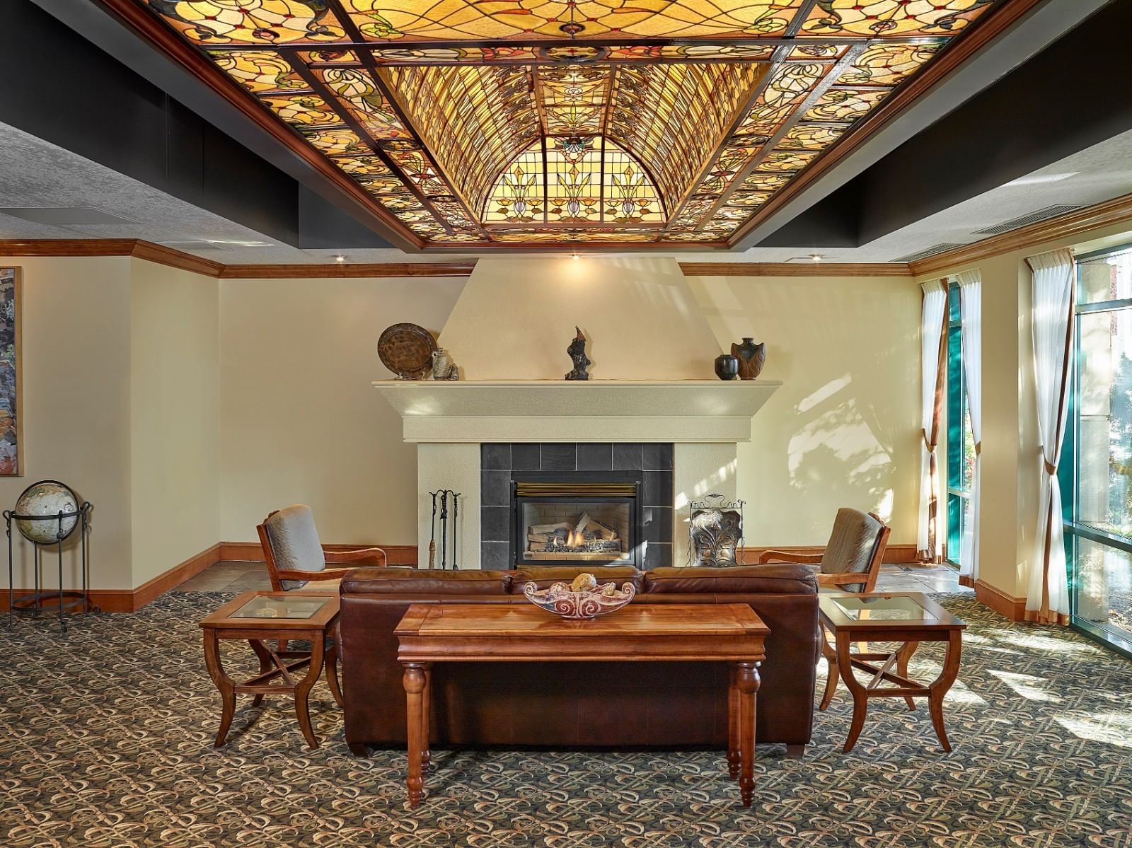 Lobby lounge area & fireplace at Varscona Hotel on Whyte