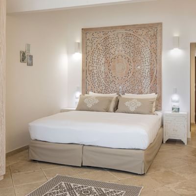 Large bed in Double Room Deluxe, Falkensteiner Resort Capo Boi