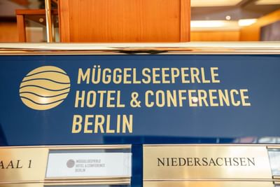 A sign of Müggelseeperle Hotel & Conference Berlin