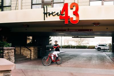 A man riding a bicycle at Hotel 43