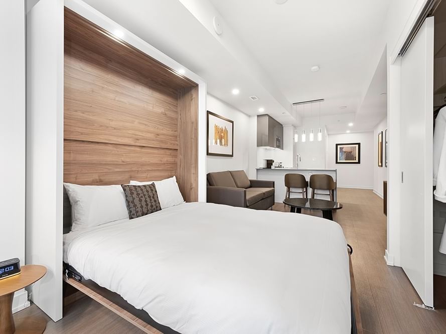 Studio Balcony bed, Livingroom & kitchen view at ReStays Ottawa