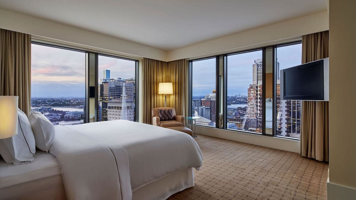 Interior of a room with a king bed at  Fullerton Sydney