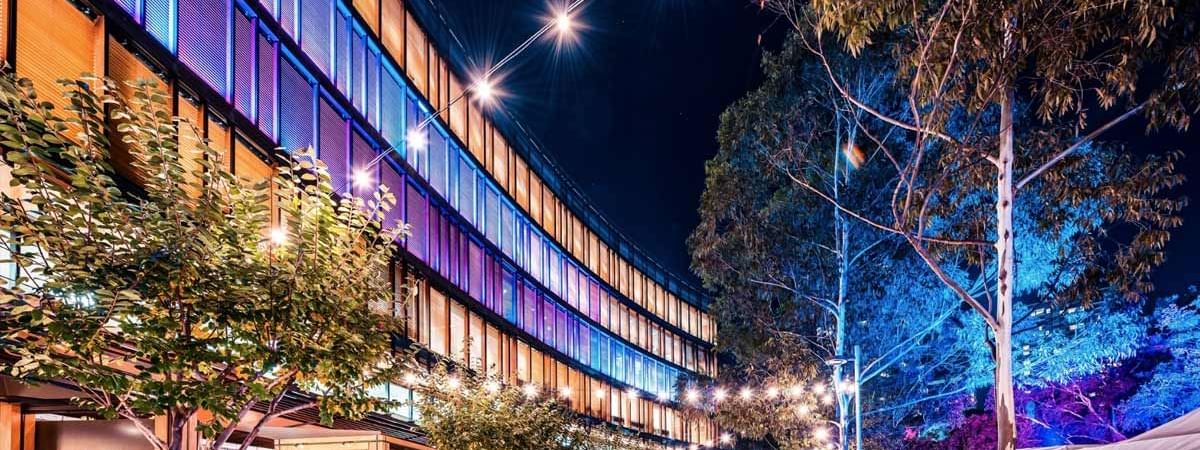 Darling Quarter at night, illuminated with colorful lights, near Novotel Sydney on Darling Harbour