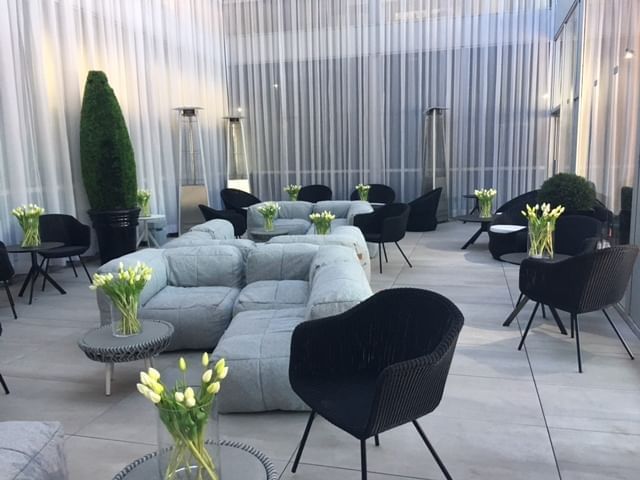 Cozy couches & tables in Atrium and Terrace at Hotel Zero1
