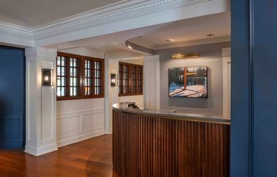 Reception desk by the lobby area with wooden floors at Portland Harbor Hotel