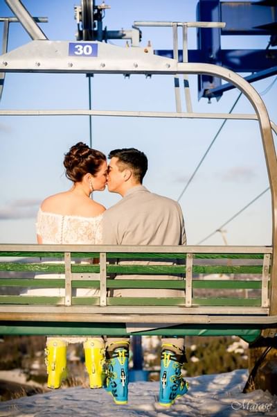 Closeup of couple kissing near Hotel Mont Gabriel Resort & Spa