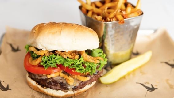 Burger with fries served in Stein Eriksen Lodge Champions Club at Chateaux Deer Valley