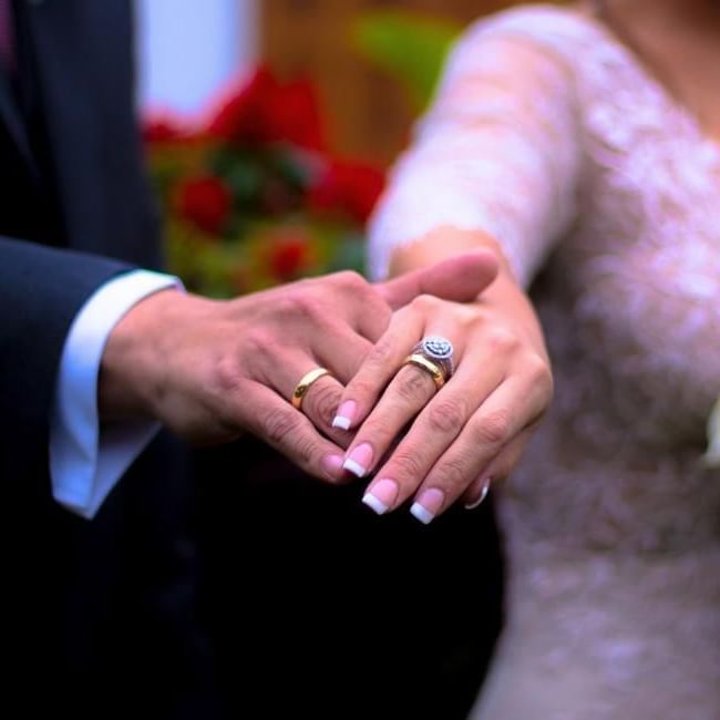 Bride and groom holding hands after tying the knot