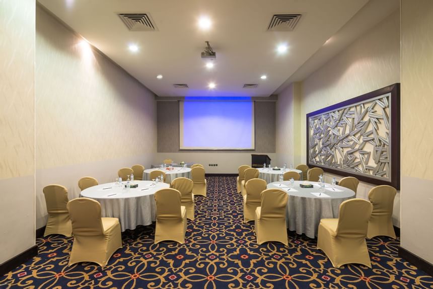 Arranged meeting room with tables & chairs at Mena Hotel Riyadh