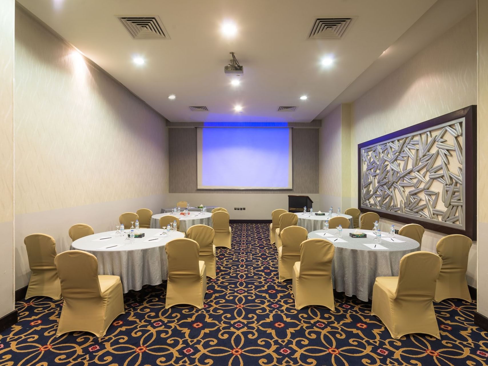 Arranged meeting room with table setups at Mena Hotel Riyadh