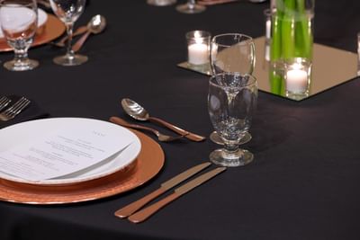 Cutlery setup on a table at NCED Hotel and Conference Center