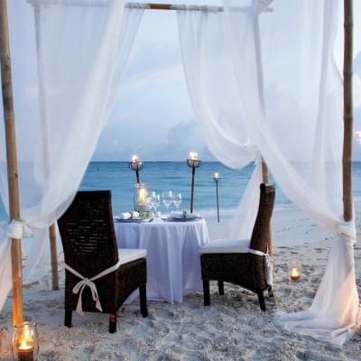 Romantic dinner table on the beach, The Somerset on Grace Bay