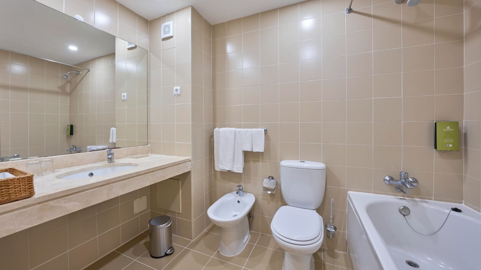 Bathroom interior with bathtub and vanity in Family Room at Bensaude Hotels